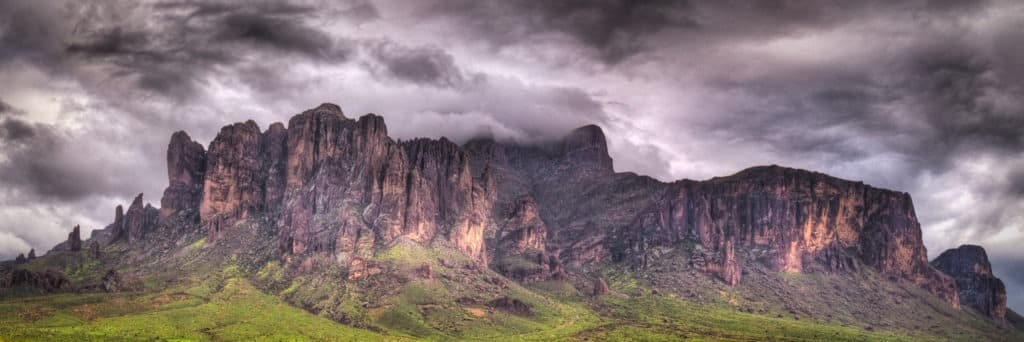 Rainstorm passes over Superstition Mountain, southeast of Apache Junction, Arizona.