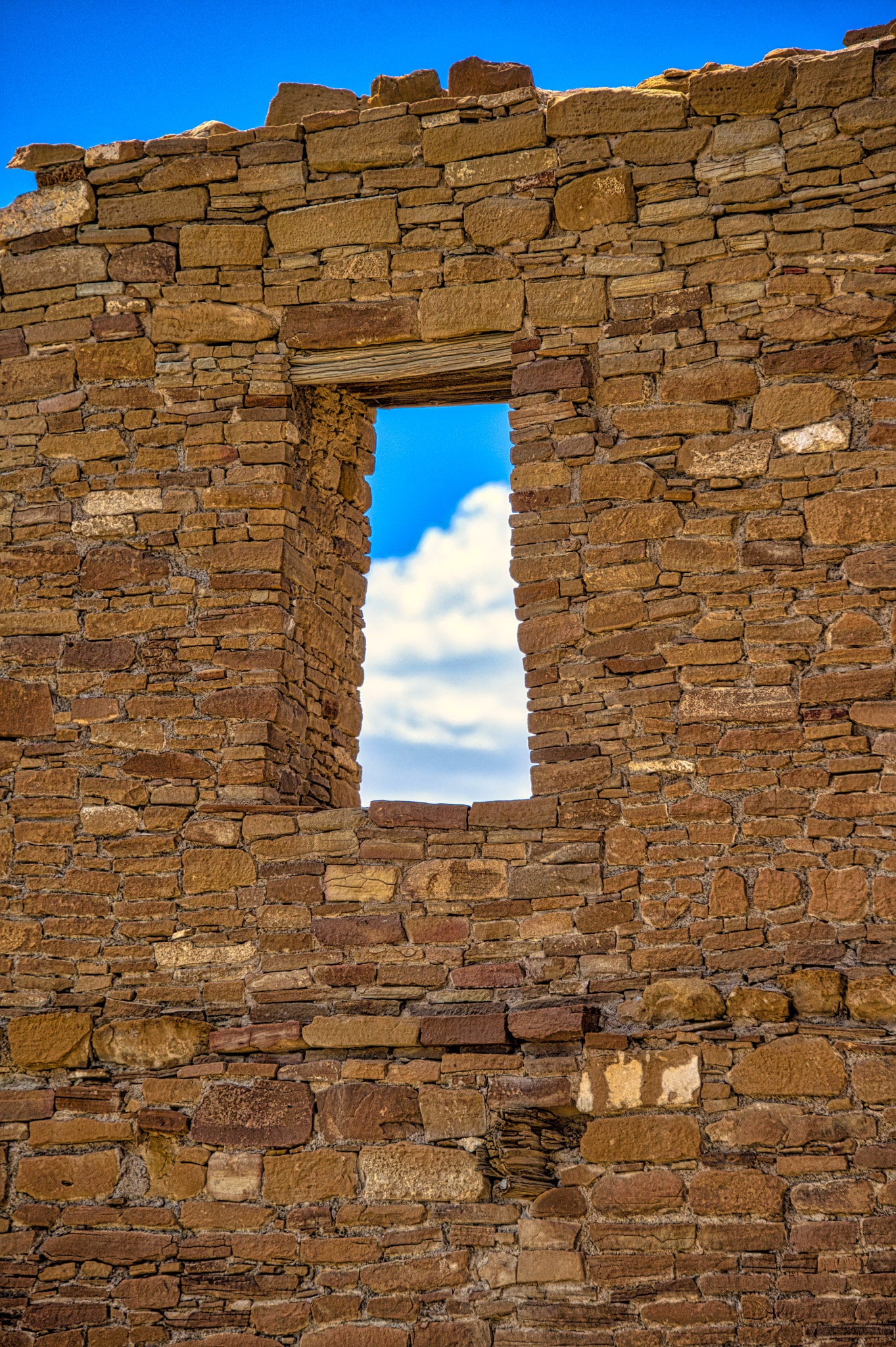 Windows provide a view to the west from Pueblo del Arroyo in Chaco Canyon, New Mexico. Wood beams provide support to the tops of windows and were brough to Chaco Canyon from as fara away as 75 miles.