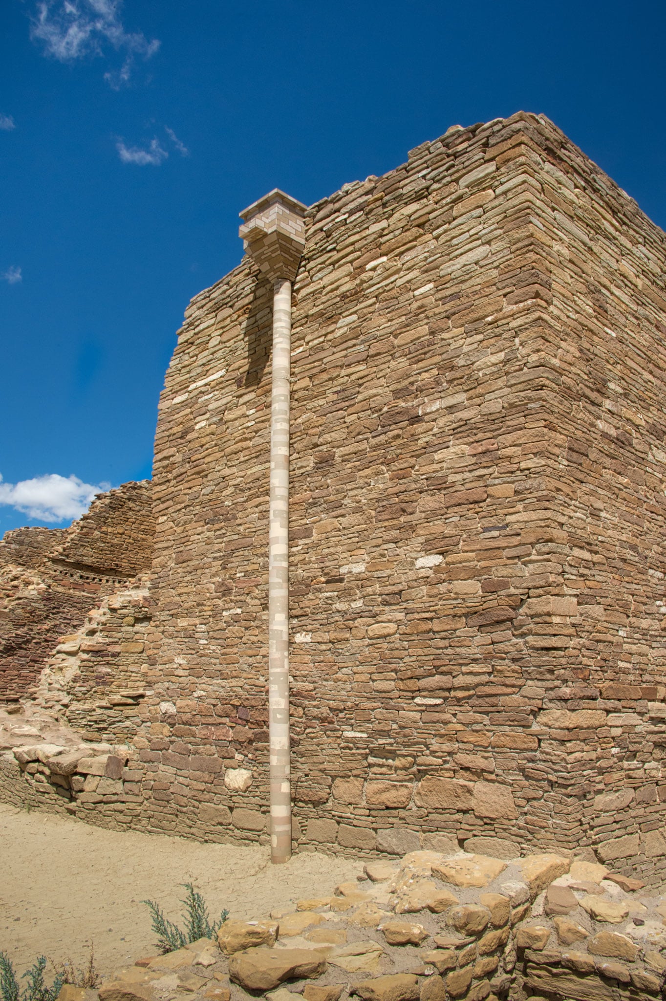 A downspout used to direct runoff from the top of a wall is painted with a camoflage pattern to help it blend in better at the Pueblo del Arroyo ruins in Chaco Canyon, New Mexico.