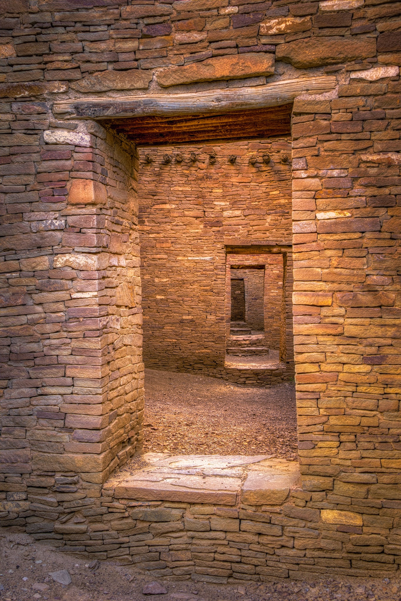 This is one of the most iconic views in Chaco Canyon. It is a shot looking through series of doorways through walls in Pueblo Bonito, located in Chaco Wash, New Mexico.