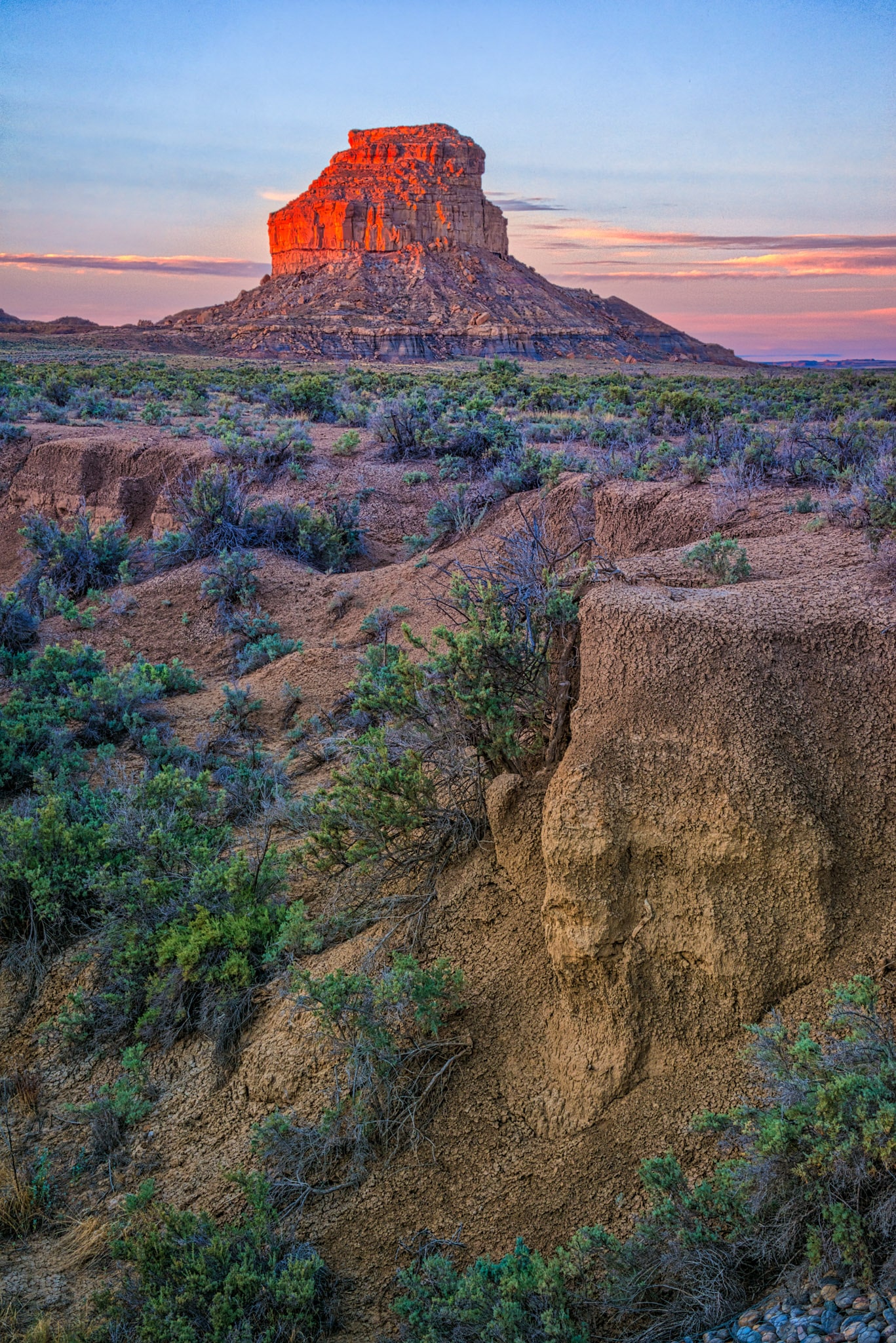 Fajada Butte in Chaco Canyon in New Mexico glows red in the early morning sun.