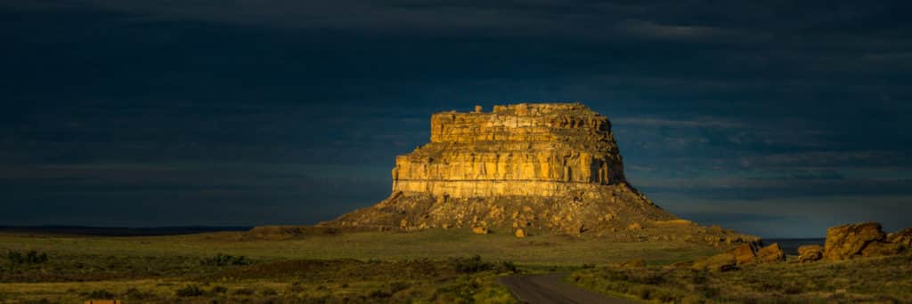 Angry clouds of evening thunderstormshang menacingly above Fajada Butte In Chaco Culture National Historical Park in Chaco Wash, New Mexico.