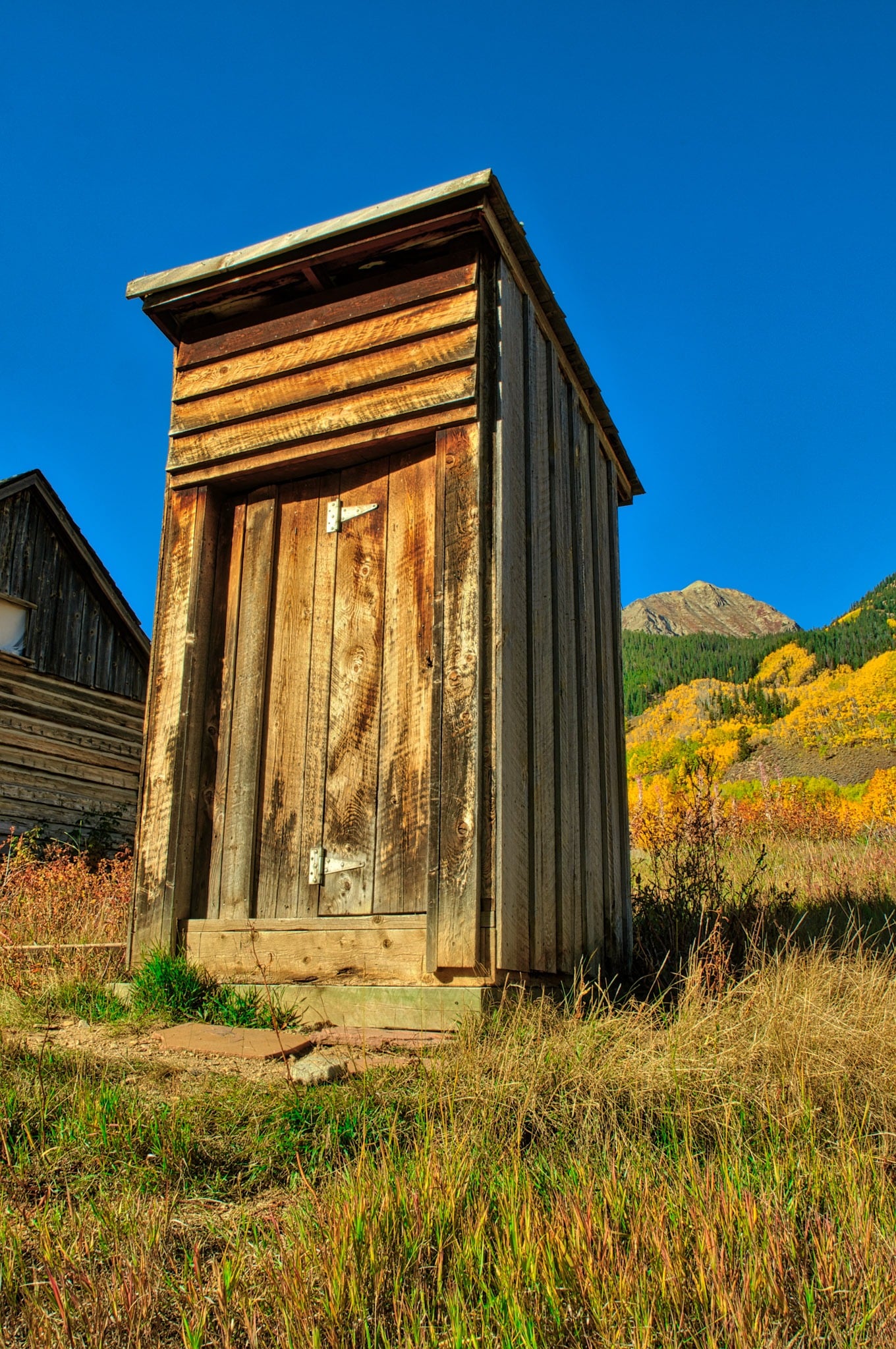 An old privy stands along a "street" in Ashcroft Ghost Town near Aspen, Colorado.
