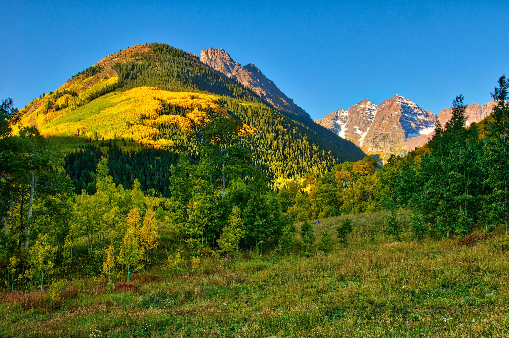 A view of the Maroon Bells in the crisp morning light in the Maroon Bells Recreation Area near Aspen, Colorado.