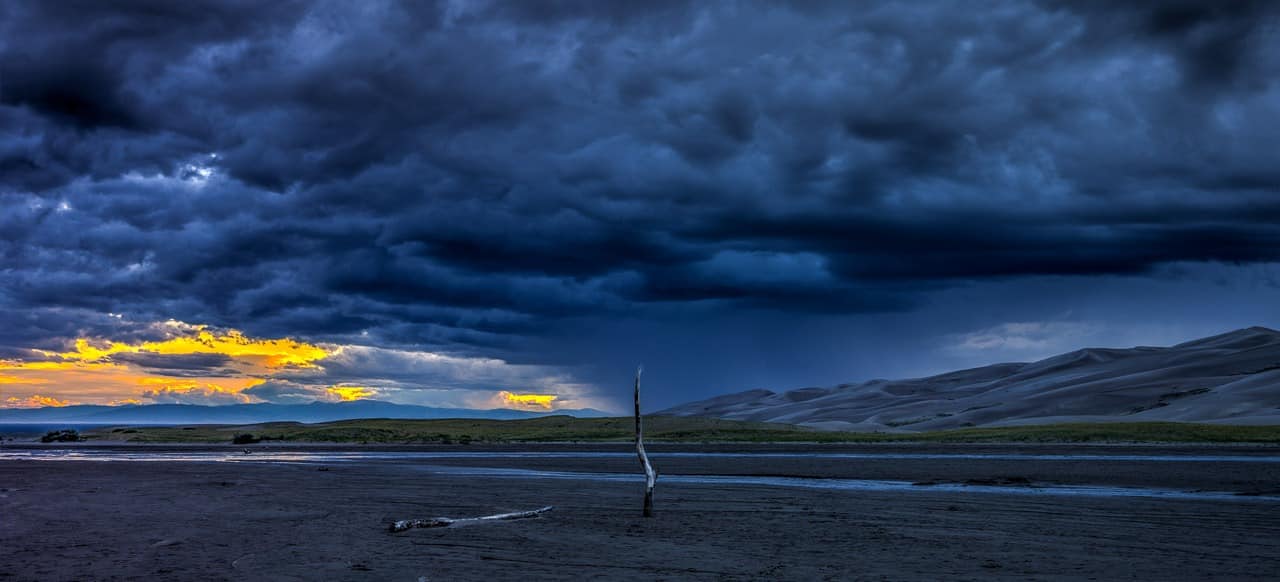 Sunset on Medano Creek in Great Sand Dunes National Park and Preserve.