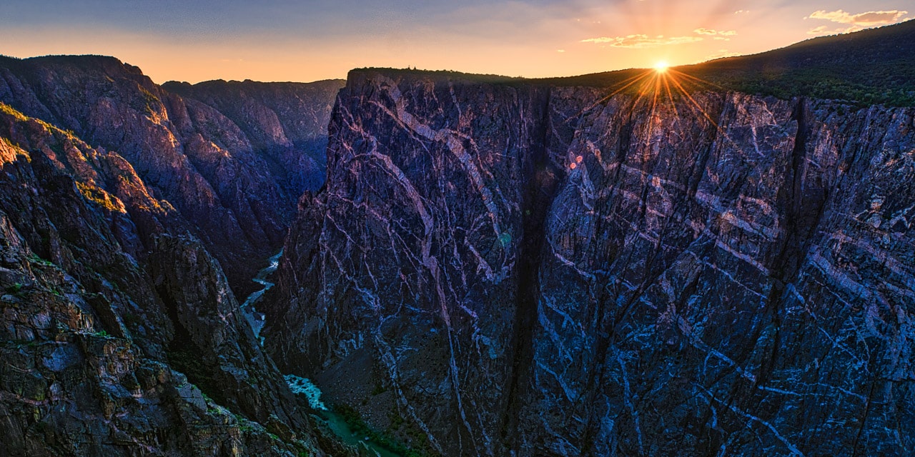 A view of the Painted Wall at sunset in Black Canyon of the Gunnison National Park in Colorado from the Painted Wall View overlook.