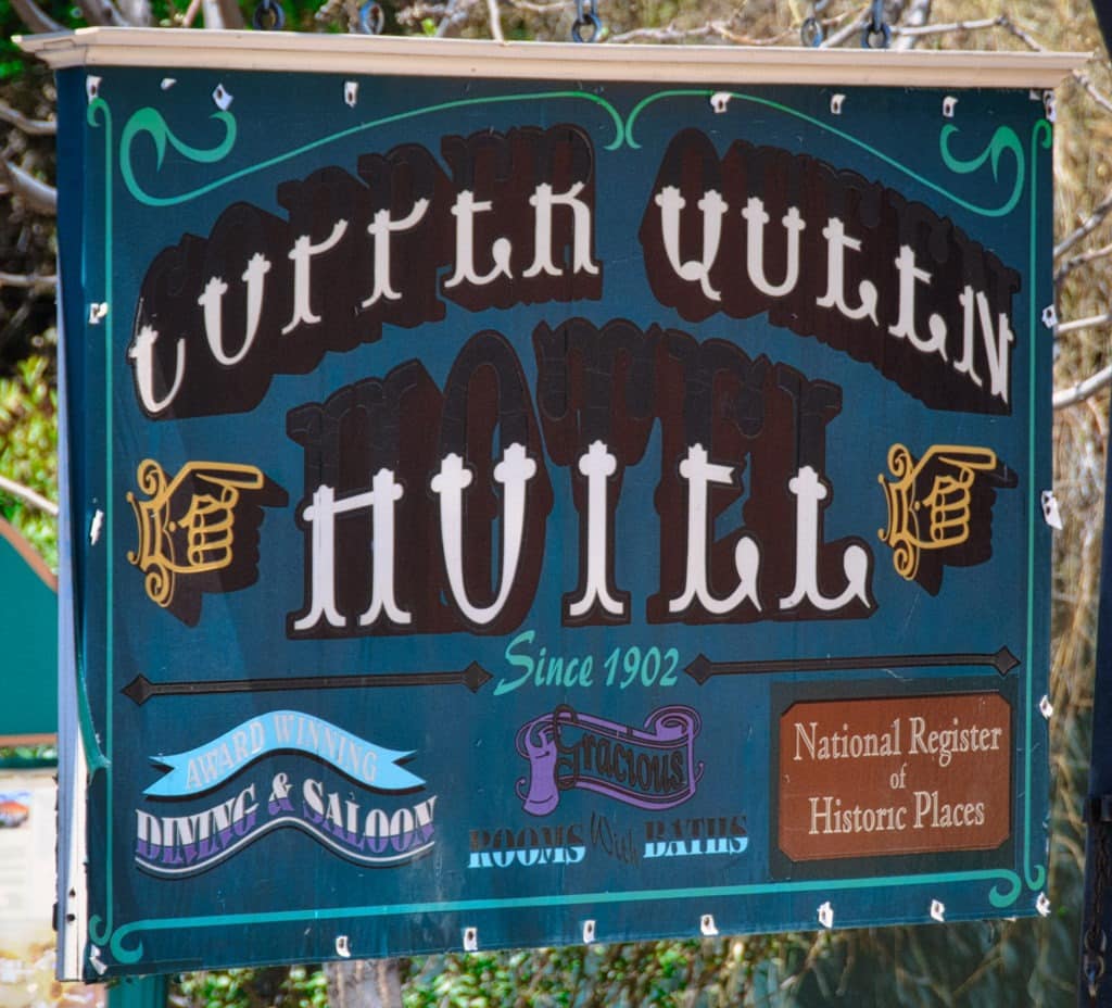 The sign for the Copper Queen Hotel in Bisbee, Arizona, is handpainted. Unfortunately, the contrast between the maroon letters and black shadows against the dark teal background is not enough to offset the optical illusion created by the white highlights.