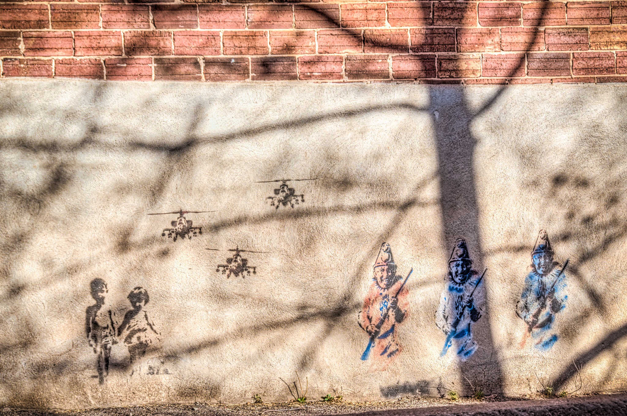 The shadows on this very odd graffiti caught our eye in an alley in Bisbee, Arizona.