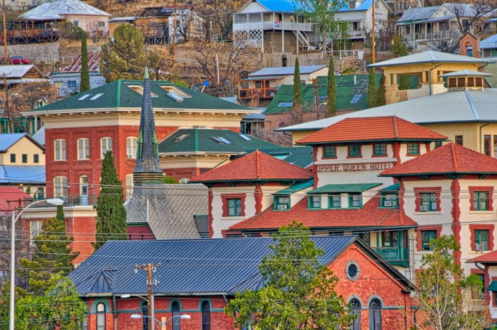 Clustered around the Copper Queen Hotel are roofs, stacked upon roof in Bisbee, Arizona.