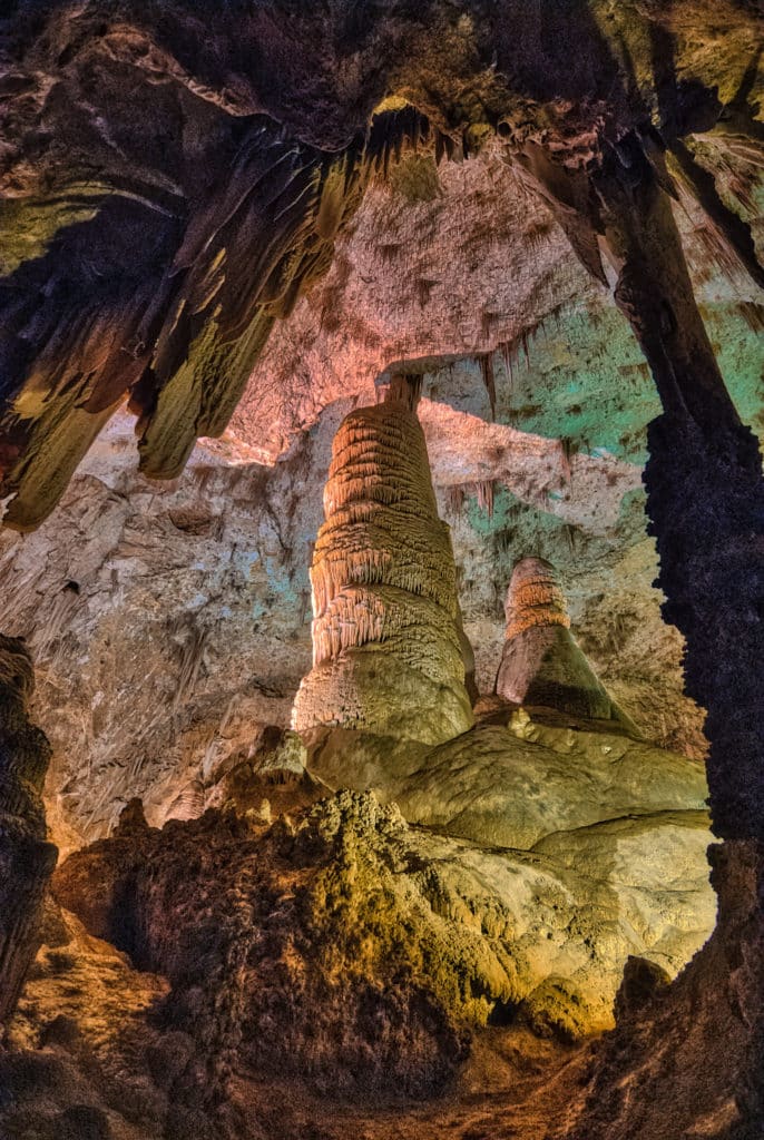 Draperies frame a view of a highly decorated stalagmite in an alcove of the Big Room in Carlsbad Caverns National Park in New Mexico.