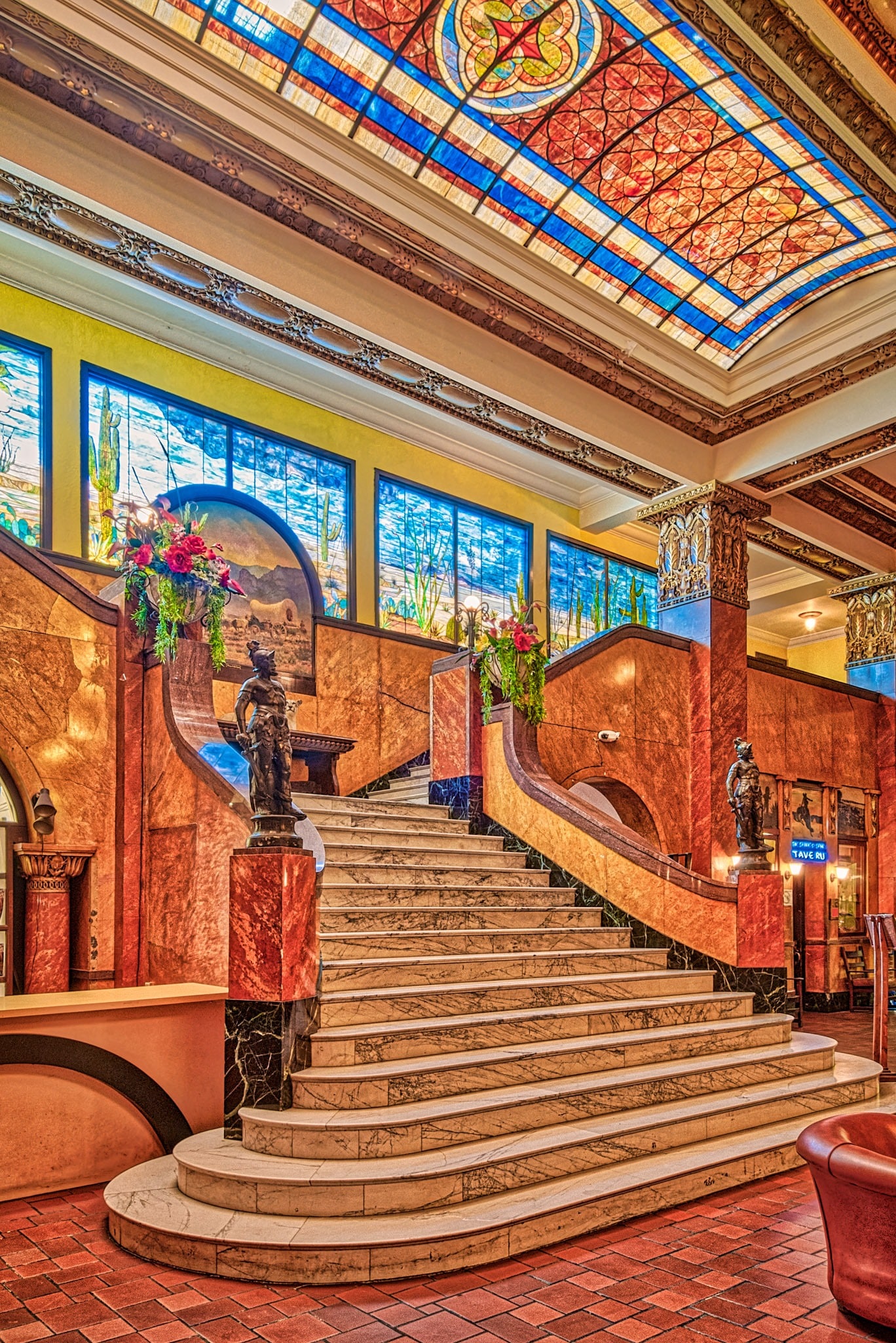 This grand staircase of Italian marble, the Tiffany glass mural, and the stained glass skylights are the centerpieces of the lobby of the Gadsden Hotel in Douglas, Arizona.