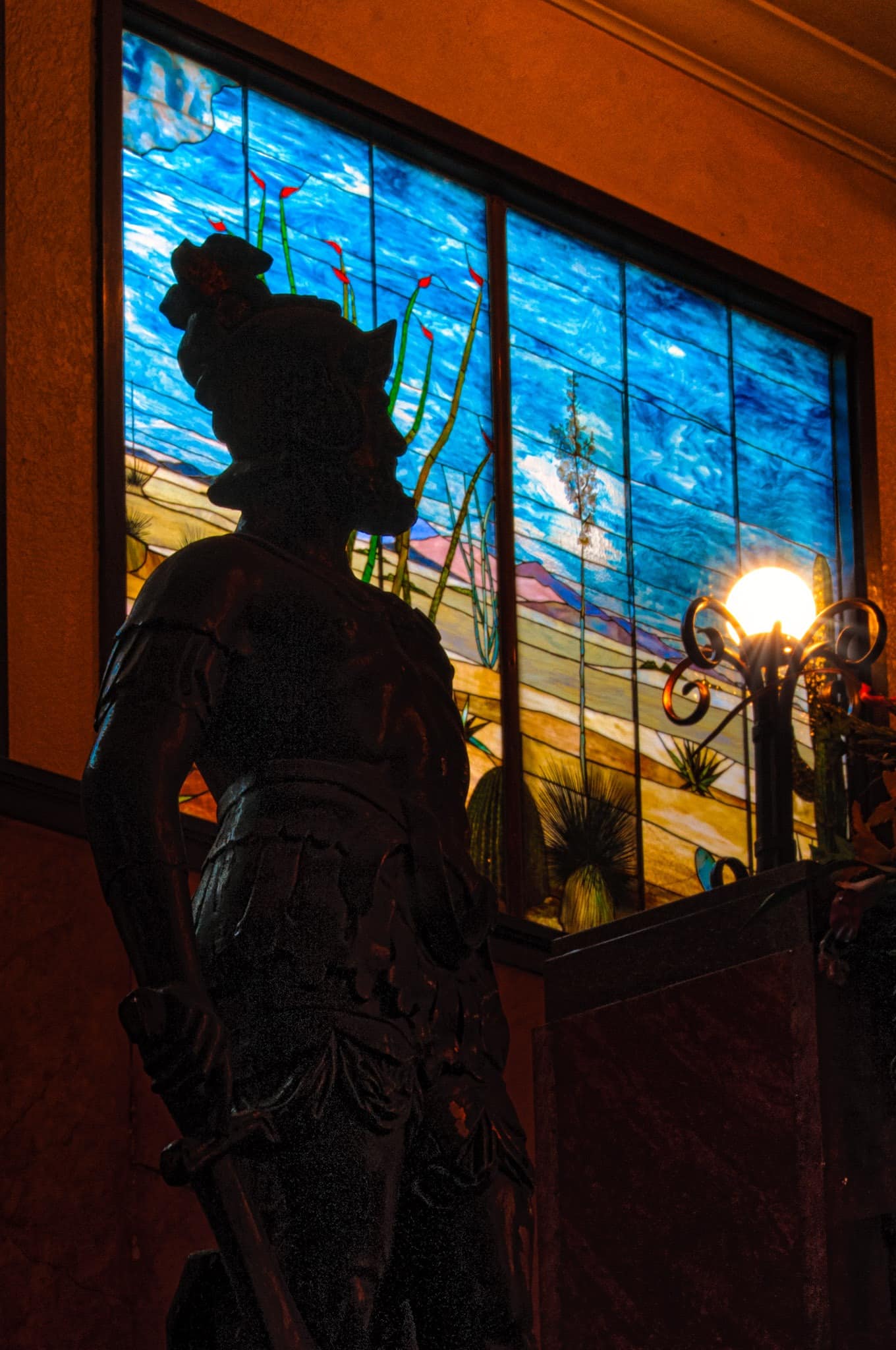 A silhouette of a conquistador, in honor of the Gadsden Purchase, stands next to the grand staircase in the lobby of the Gadsden Hotel in Douglas, Arizona.