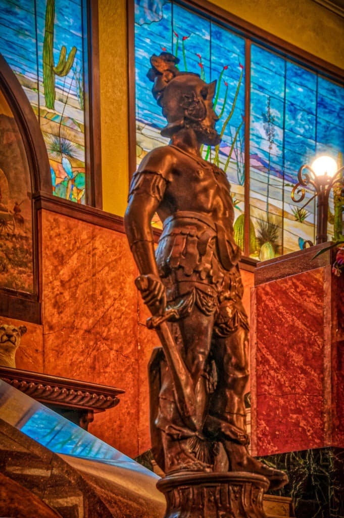 A statue of a conquistador, in honor of the Gadsden Purchase, stands next to the grand staircase in the lobby of the Gadsden Hotel in Douglas, Arizona.