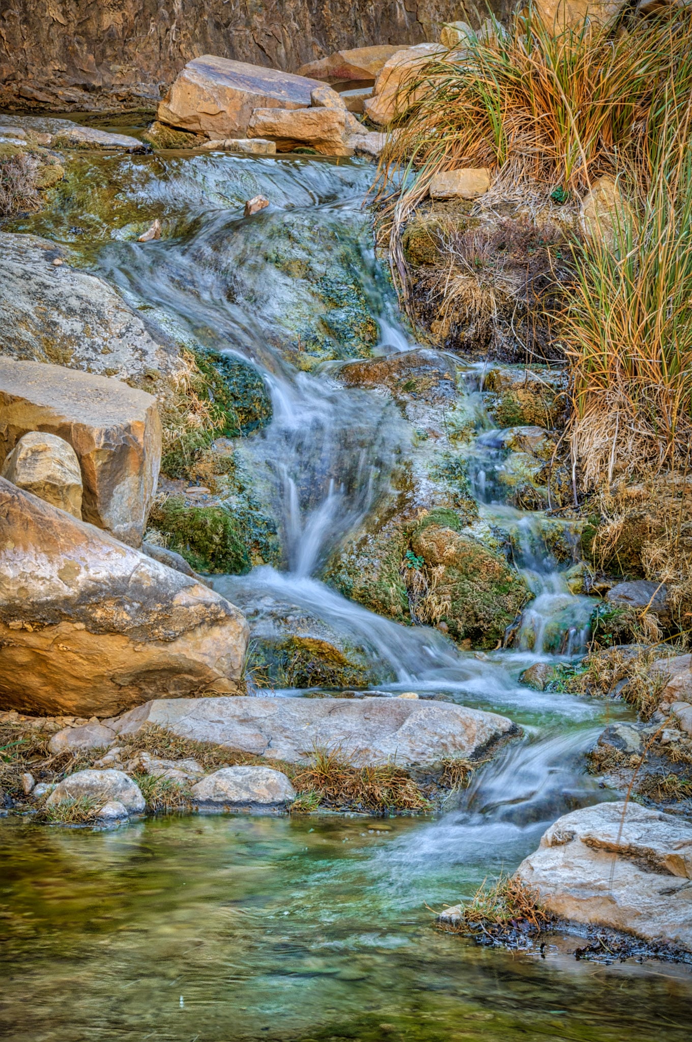 A small cascade babbles over rock below Sitting Bull Falls in Sitting Bull Falls Recreation Area near Carlsbad, New Mexico.