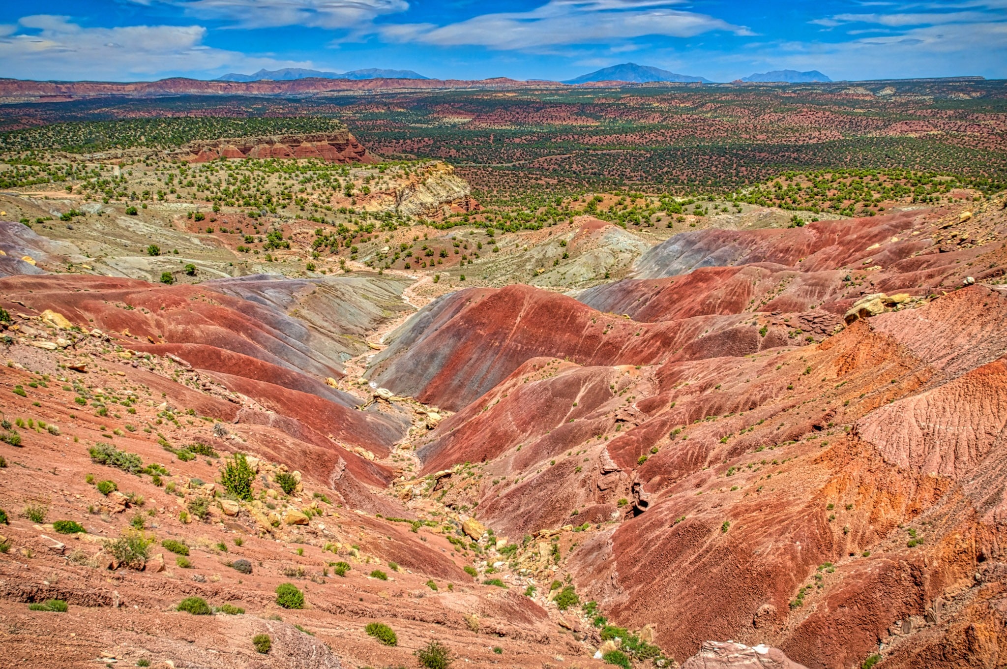 These badlands provide a colorful respite from the steep sandstone canyons farther east near Bullfrog, Utah, close to Capitol Reef National Park.
