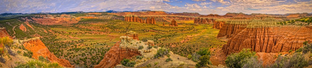 Panoramic view of Cathedral Valley in Capitol Reef National Park, Utah, with the Temples of the Sun and Moon in the distance. This panorama was taken from Cathedral Valley Overlook on Hartnet Road.