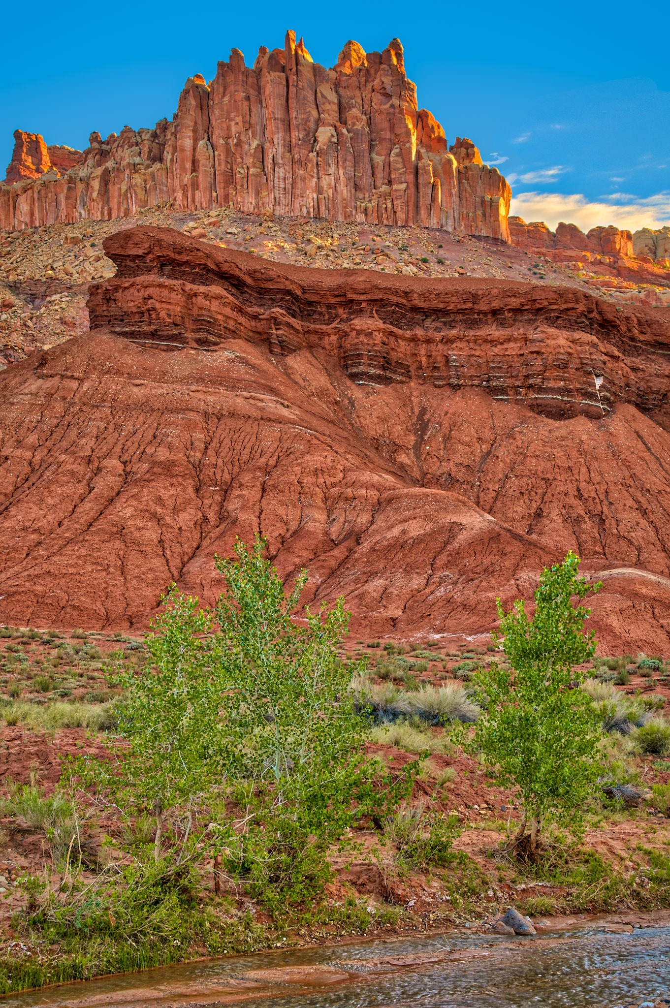 Along Utah Highway 24 near the Capitol Reef National Park Visitor Center, you can see layers of vari-colored rock formations, including the Chinle Formation, in a feature called The Castle.