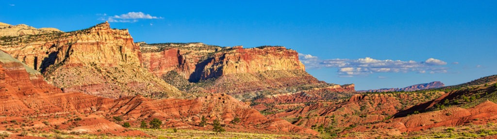 The afternoon light enhances the rich colors of the Moenkopi, Chinle, Wingate, and Navajo formations, as seen from Scenic Drive, south of Fruita in Capitol Reef National Park, Utah.