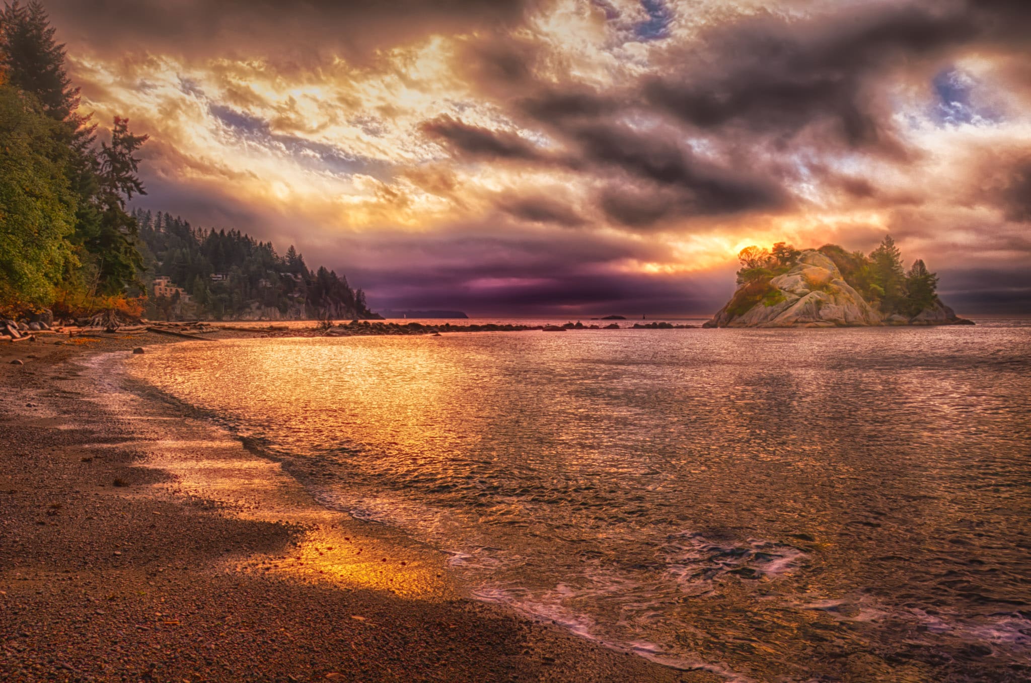 A view at sunset along the shore of Whytecliff Park with Bowyer Island, in West Vancouver, British Columbia.