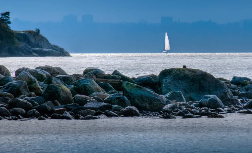 A view at sunset along the shore of Whytecliff Park with Bowen Island, in West Vancouver, British Columbia.