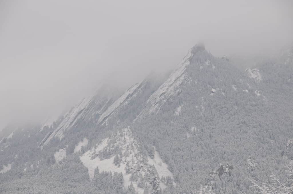 The Flatirons in Boulder, Colorado, are barely visible in the early spring snow storm.