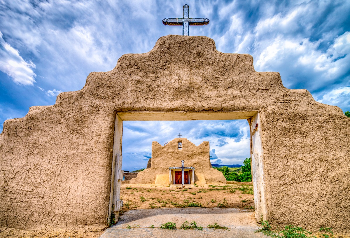 The San Lorenzo de Picuris Mission Church, located in Picuris Pueblo near Peñasco, NM, was orinially built in 1621. The building we see today is in a slightly different location within the pueblo. construction was started around 1776 and was visited by Father Visitor Domínguez. The church was "modernized" in the early 20th Centuray with a pitched metal roof and other so-called improvements. In the 60's, after careful excavation and research, the structure was reconstructed and its original profile restored to appear much as it did in 1778. The mission was rebuilt with deference to traditional methods, thanks to volunteers who molded thousands of adobe bricks by hand.