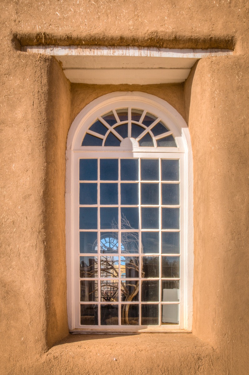 This is one of the windows in the sanctuary of San Francisco de Asis Mission Church in Ranchos de Taos, New Mexico.