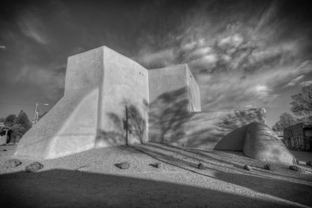 Evening shadows appear on the rear of the San Francisco de Asis Mission Church in Ranchos de Taos, New Mexico