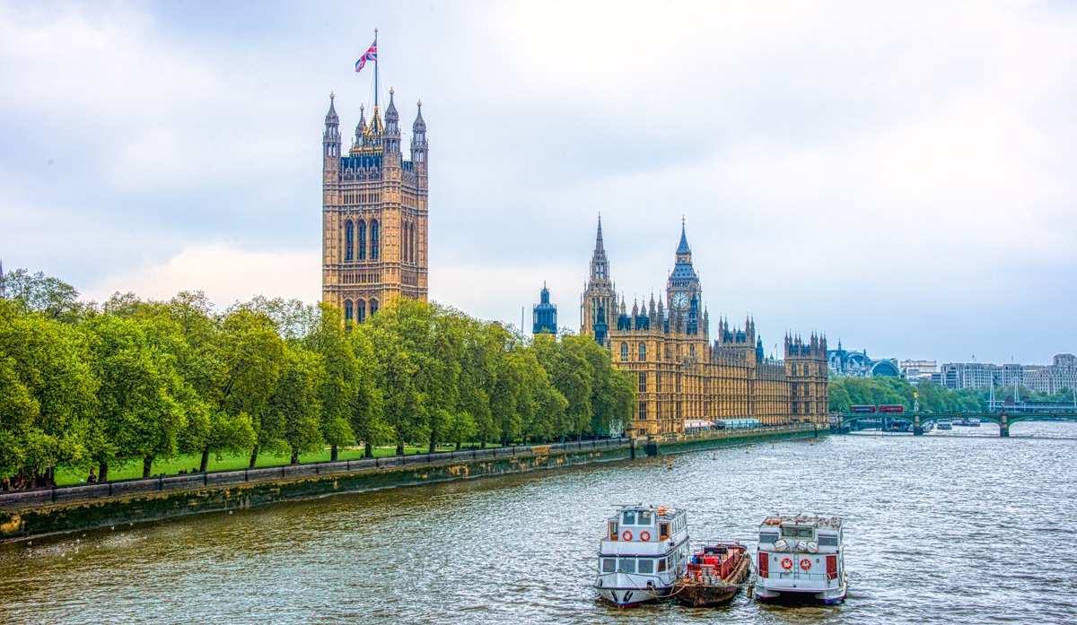 This is a view of the Palace of Westminster taken from the Lambeth Bridge, which crosses the Thames River. In the foreground is the Victoria Tower. In the Background is the top of Big Ben.