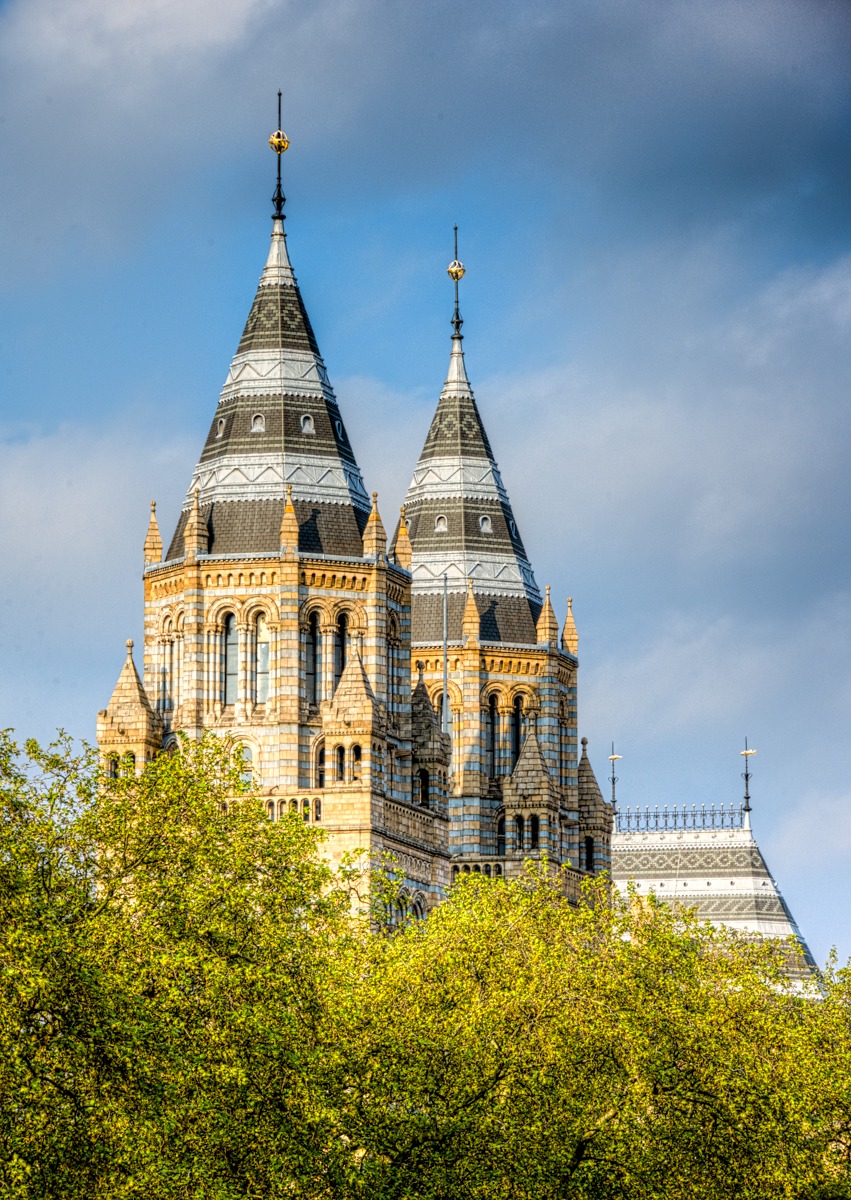 These massive, ornate towers flank the grand entrance to the Natural History Museum in London, England.