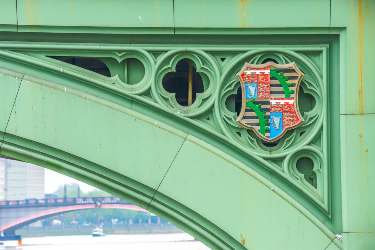 This detail of the Westminster Bridge shows Prince Albert's coat of arms. Through the bridge, at the lower left, you can see a portion of the Lambeth Bridge with its distinctive red paint.