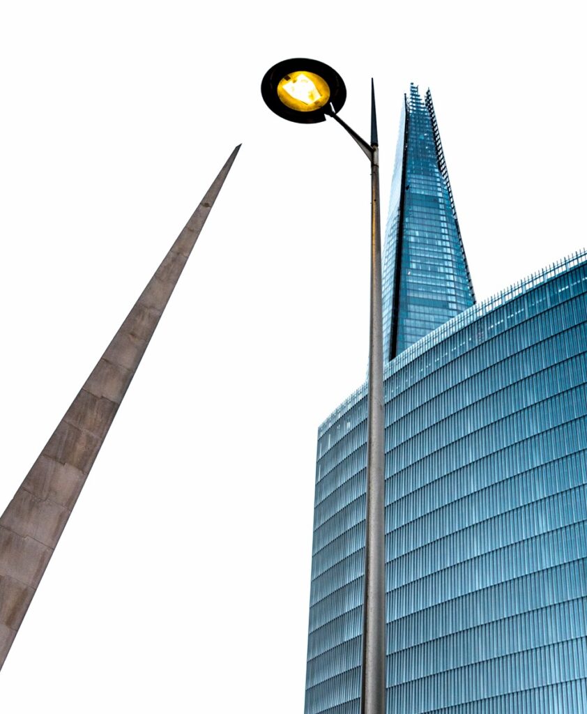 Here is a juxtaposition of the Needle Sculpture, a modern street lights and the Shard near London Bridge in London, England.