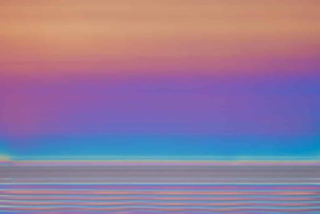 The side of a berry container was photographed through an upper and lower polarizing filter. The result looks like alpenglow. This photograph appears in the June 2019 issue of ArtAscent Journal.