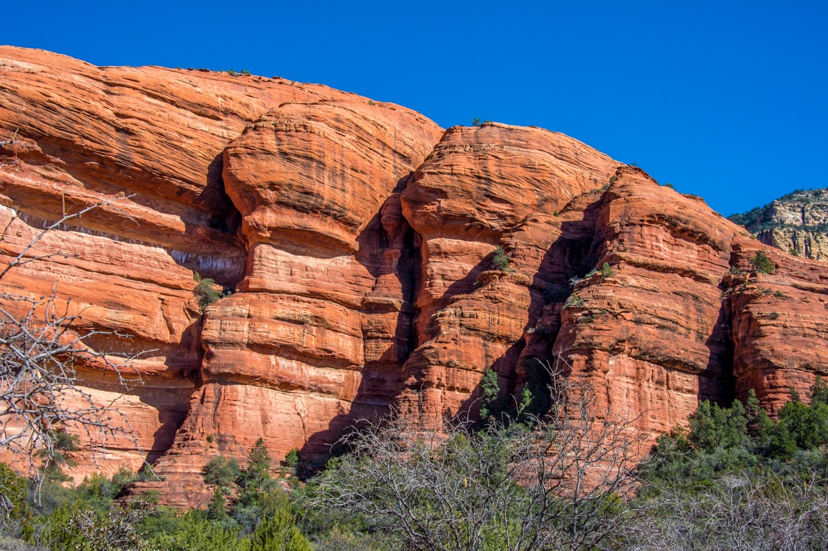 A closeup of the red sandstone cliffs that surround Palatki Heritage Site near Sedona, Arizona.