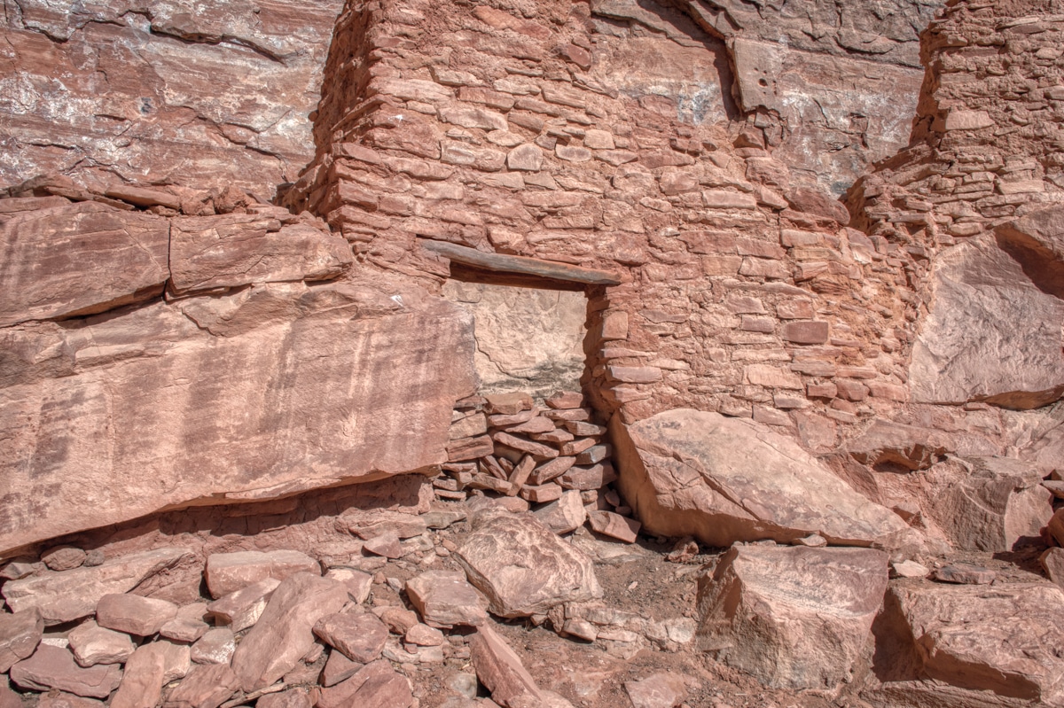 A closeup of a doorway in one of the remaining walls of the cliff dwelling at Palatki Heritage site near Sedona, Arizona. Notice the log lentel.