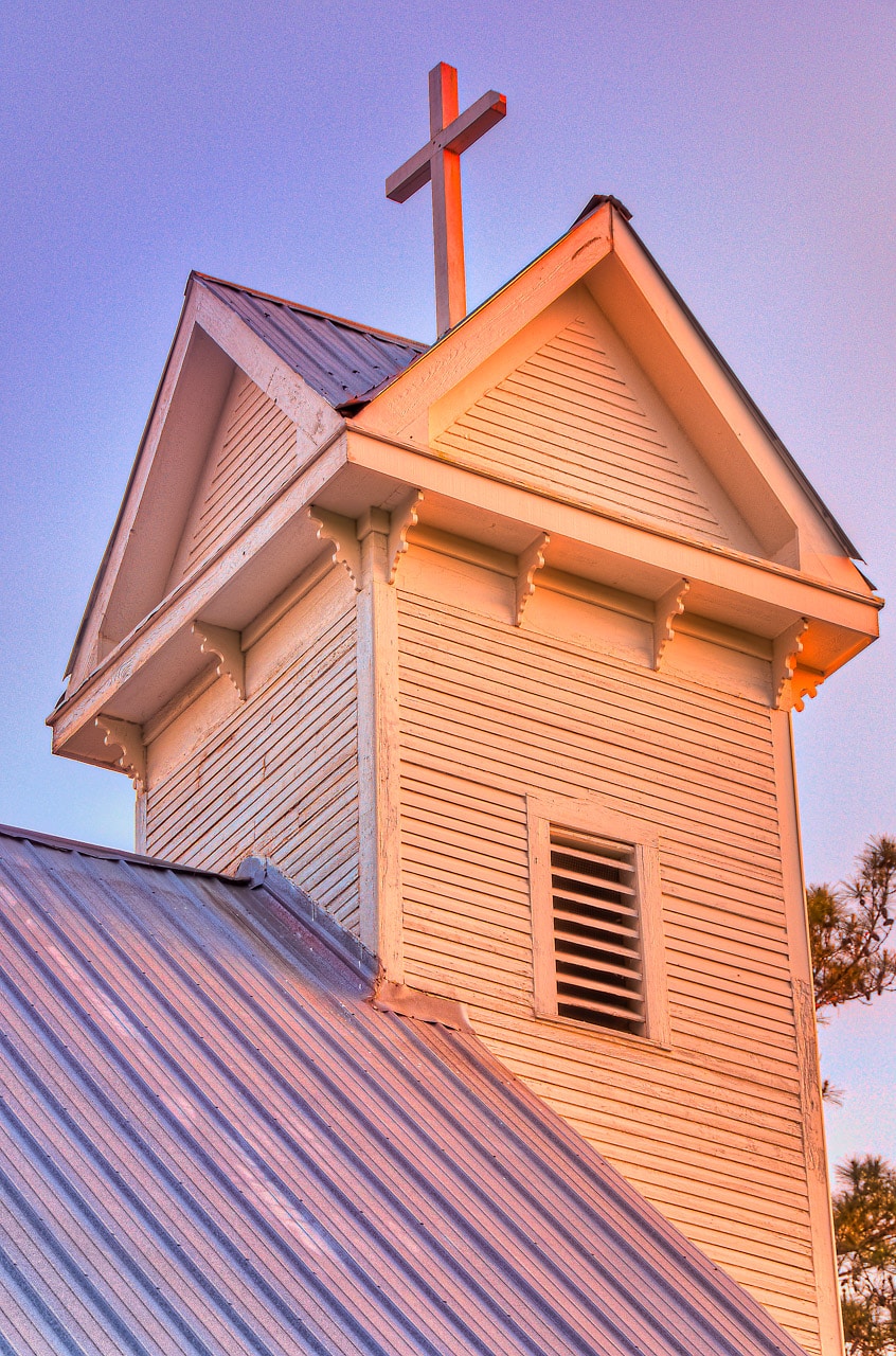 Sunset light illuminates the steeple of Saint Mary's Episcopal Church in Evergreen, Alabama