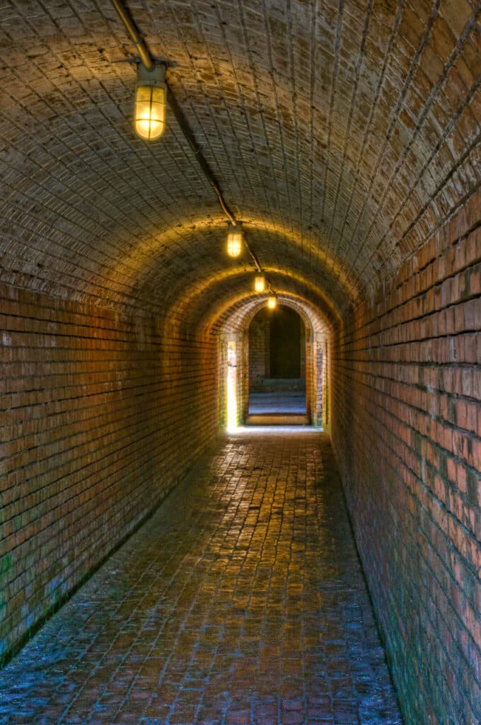 Deep within the walls of Fort Gaines, on Dauphin Island, Alabama, this tunnel leads to a staircase up to one of the bastion cannons.