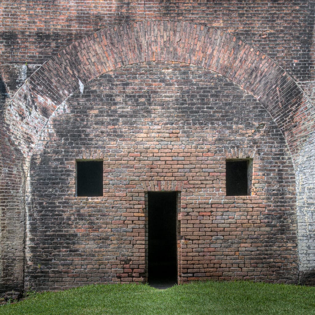 A doorway and two window look like a face inside the walls of Ft. Morgan at the mouth of Mobile Bay on Alabama's Gulf coast, near Gulf Shores, Alabama.