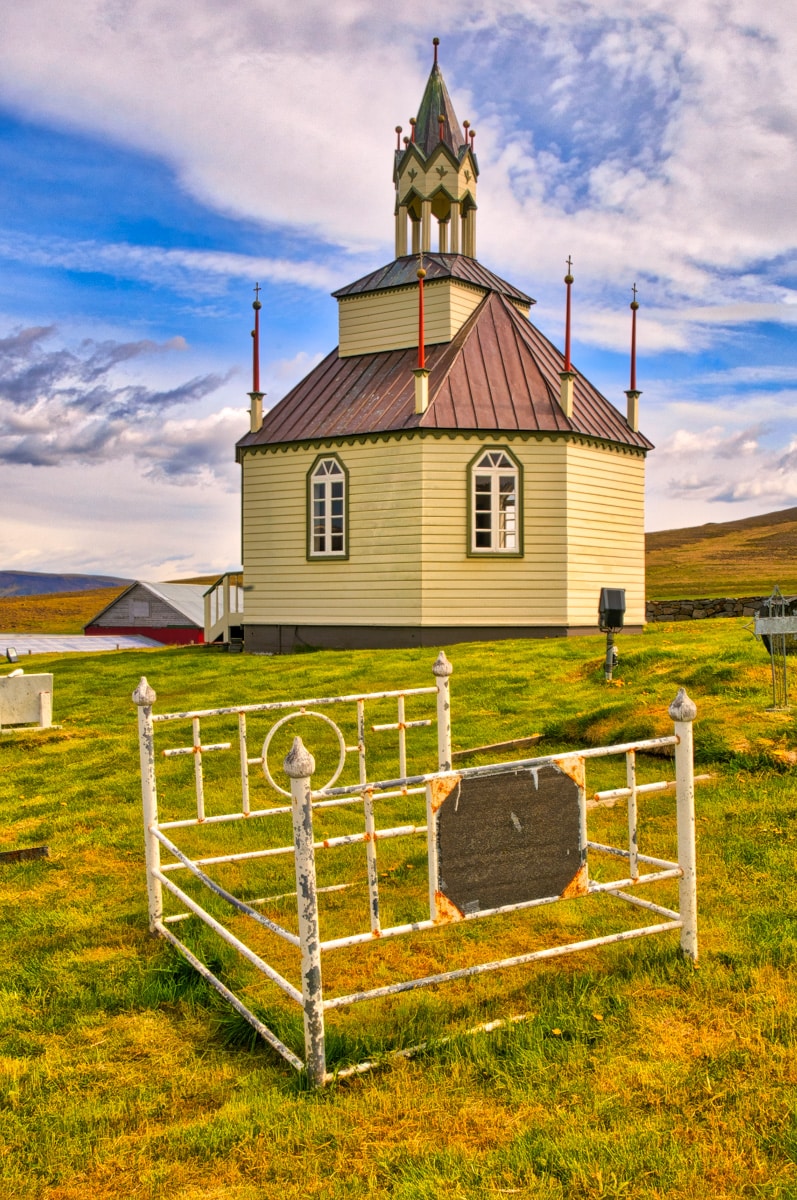Three graves in the cemetery at Auðkúlukirkja are beadsteads. The church itself is octagonal. Iceland seems to treasure creativity and individualism. Although we had never seen the practice before, it is apparently not that rare. For instance, iron bedframes are used in the Wind River Reservation cemetery in Fort Washakie, Wyoming, USA.
