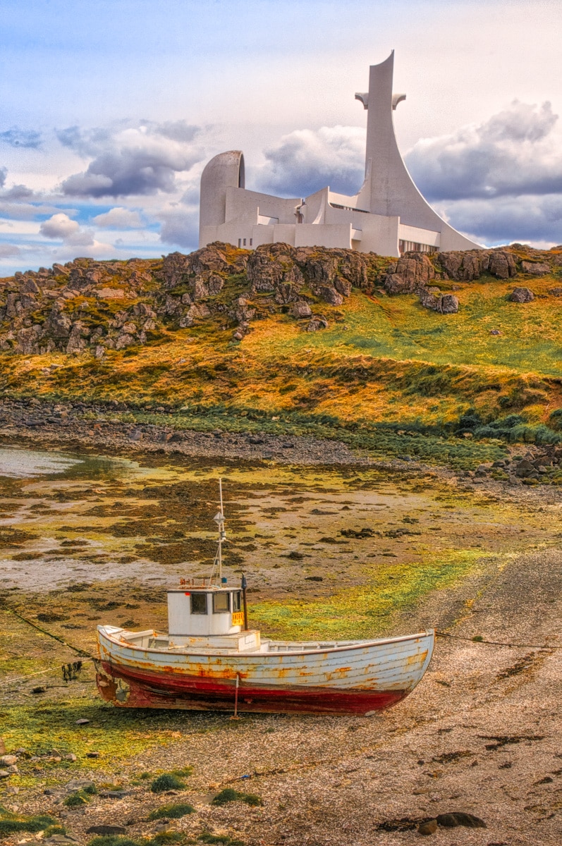 The modern church at Stykkishólmur, Iceland, looms over a simple boat.