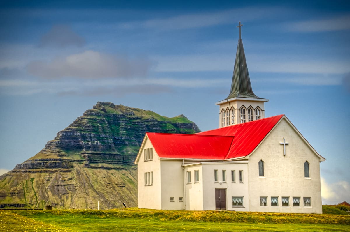 The church at Grundarfjörður, Iceland. The mountain in the background is Kirkjufell, which translates as Church Mountain.