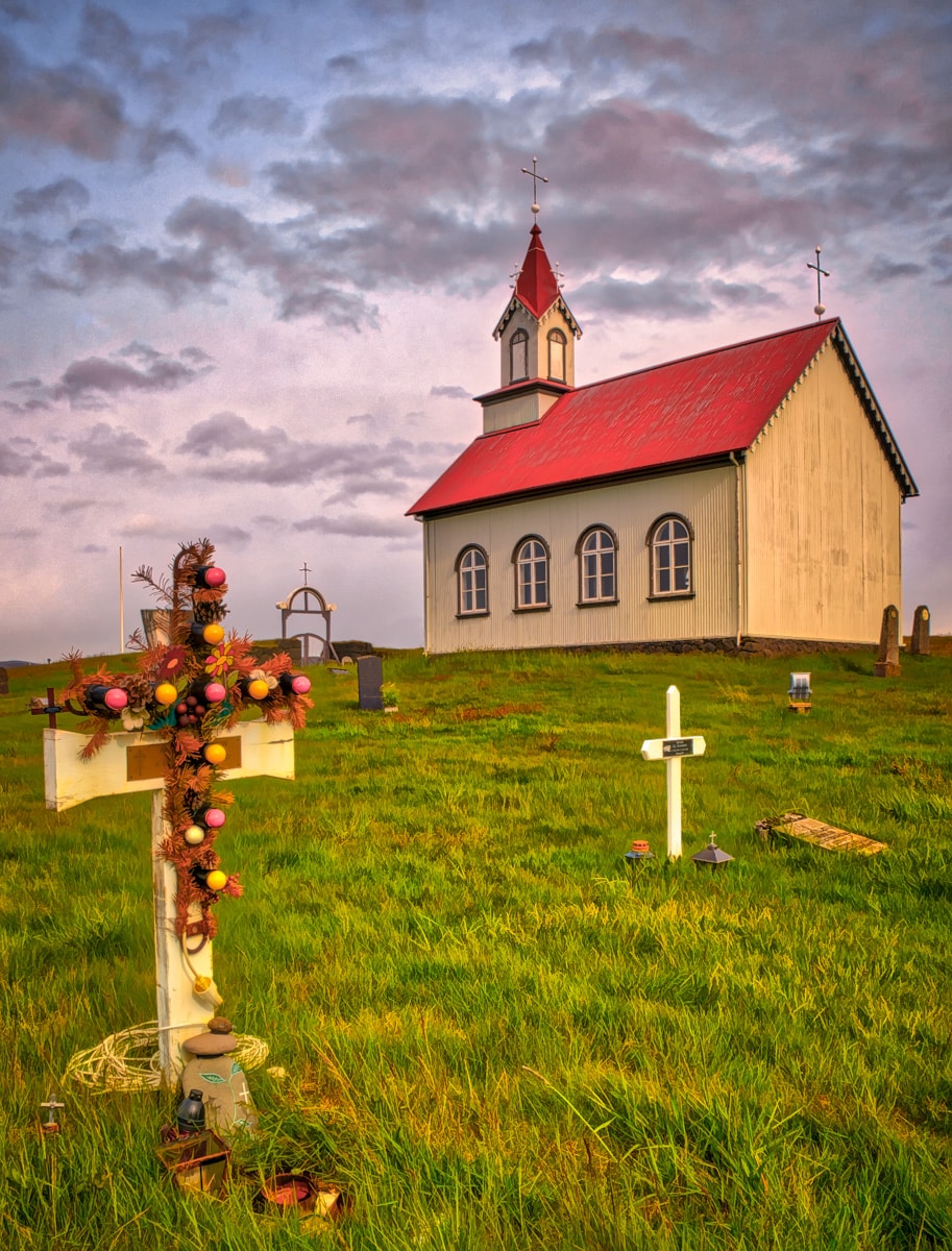 To an outsider, the electric lights on this cross at the church Hraungerðiskirkja in southeastern Iceland might seem odd. However, in a land where daylight is scarce for much of the year, the illuminated cross makes a fitting memorial - and a practical navigation aid to find the grave.
