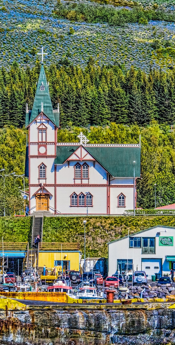 The church in the port town of Húsavík is a major landmark, with the belltower measuring 26 meters (over 85 feet) in height. It was built in 1907 from wood, a somewhat costly building material because it had to be imported from Norway.