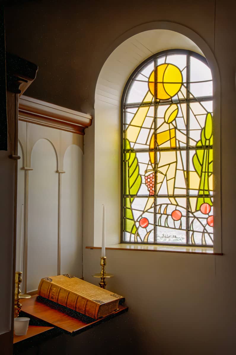 This is one of the stained glass windows seen from within the interior of the church in Vik on the south coast of Iceland. The window was designed and crafted by Hrafnhildur Agustsdottir.