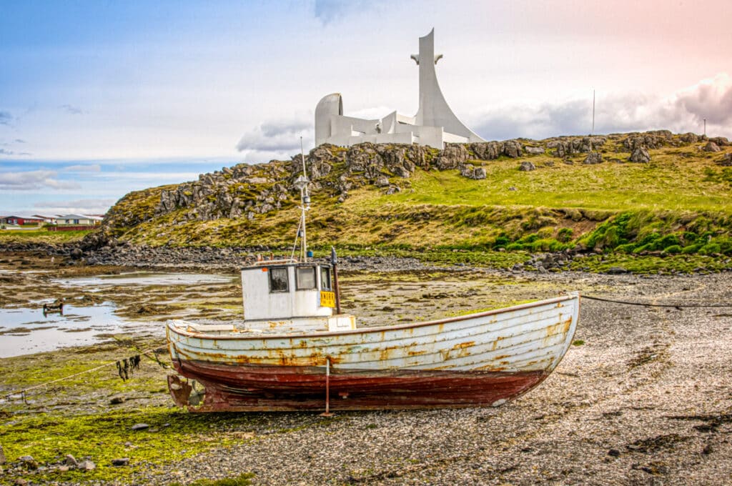 The modern church at Stykkishólmur, Iceland, looms over a simple boat.