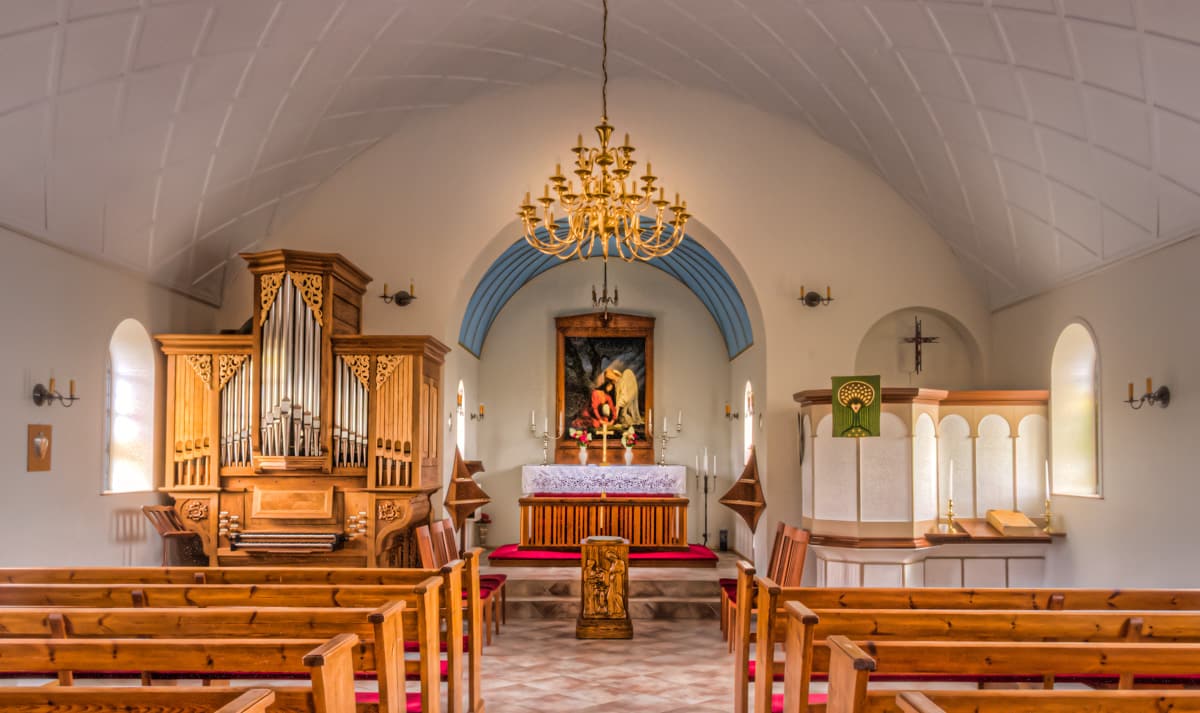 The interior of the Vik Church, also known as Reynir's Church, has a barrel vault ceiling. Notice the lovely pipe organ.