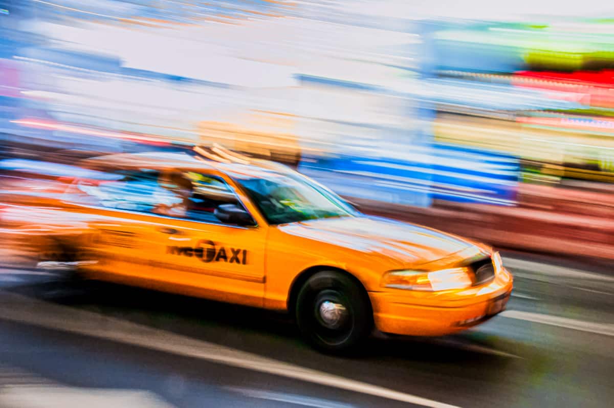 The required speeding taxi shot in New York City.