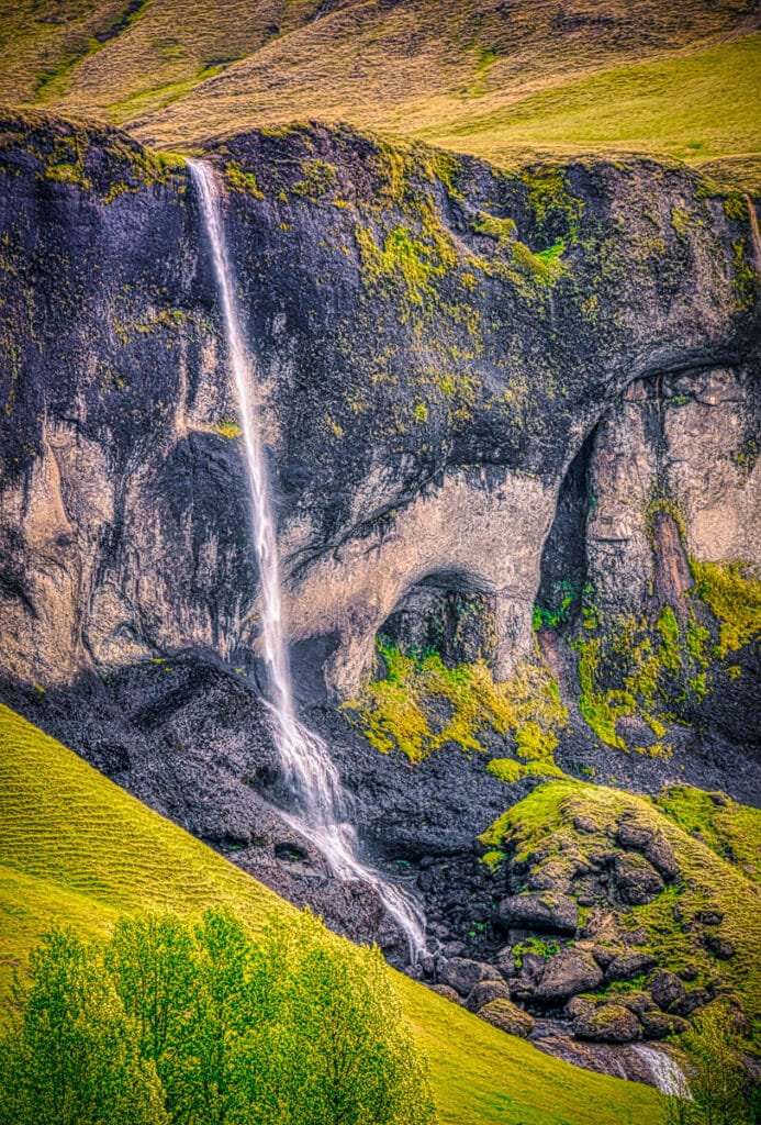 This beautiful waterfall, called Foss á Siðu, is fed by a small lake called Þórutjörn. This view was taken from the road, while heading down to the valley floor. Foss á Siðu in southern Iceland is both a farm complex and a striking waterfall. It is located east of Kirkjubæjarklaustur, about 15 km.