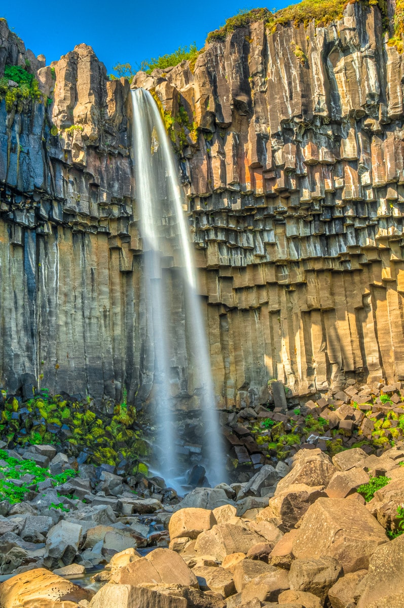This is a smooth, timed exposure of Svartifoss. Having translated Svartifoss as "dark falls" I was expecting something more somber, but the low sun warmed the overhanging basalt columns and gave the waterfall a warm feel. Svartifoss is in Skaftafell National Park.