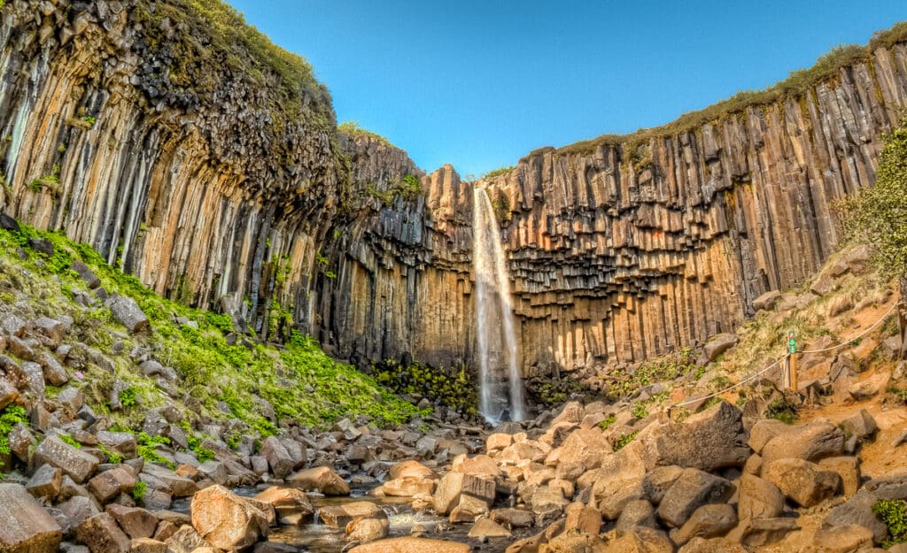 Basalt columns surround the waterfall Svartifoss in southern Iceland. Svartifoss is one of the jewels of the Skaftafell, which is part of Vatnajokull National Park.